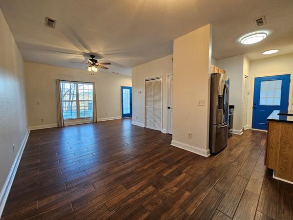 175 Boardtown Road Ellijay, GA 30540 - Photo 12 of 29 a view of a livingroom with hardwood floor and a ceiling fan