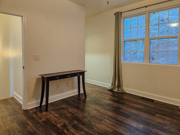 175 Boardtown Road Ellijay, GA 30540 - Photo 21 of 29 a view of an empty room with wooden floor and a window