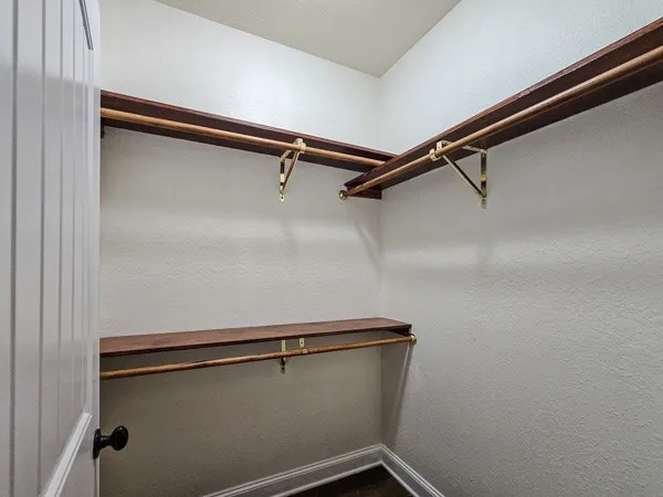 a view of a room with racks on the wall