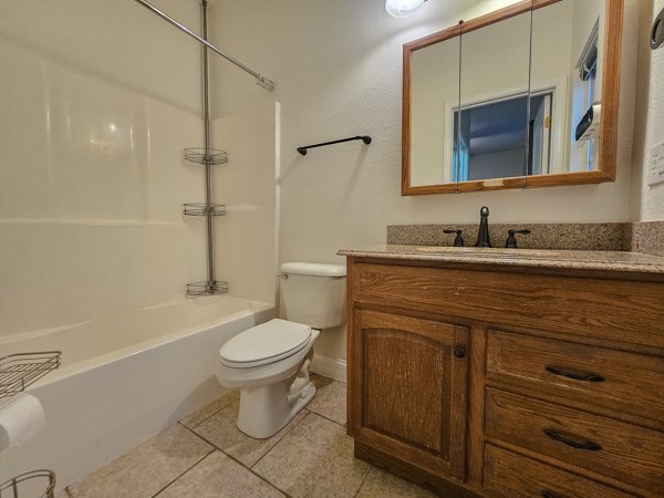 175 Boardtown Road Ellijay, GA 30540 - Photo 24 of 29 a bathroom with a toilet sink and mirror