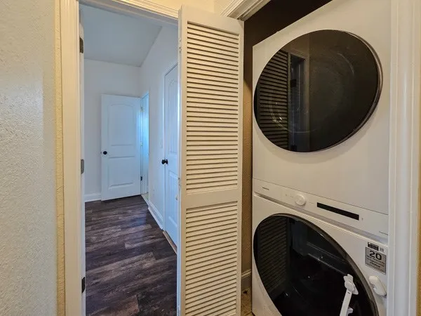 a view of a hallway with washer and dryer