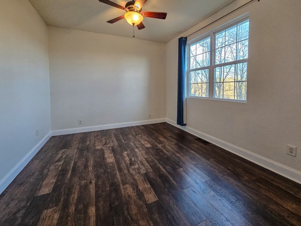 175 Boardtown Road Ellijay, GA 30540 - Photo 26 of 29 a view of an empty room with wooden floor and a window