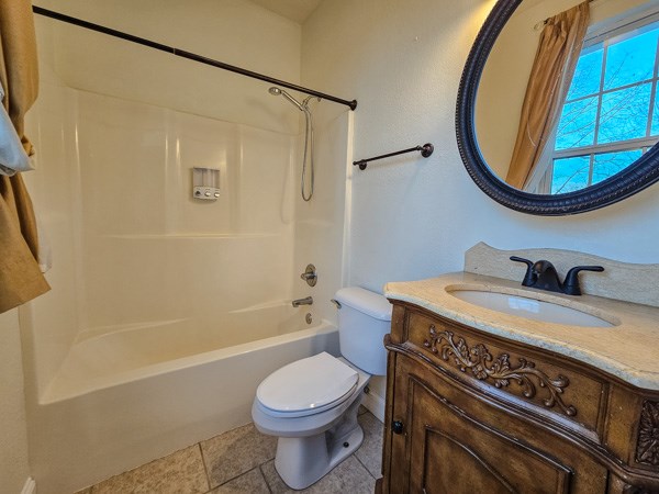 175 Boardtown Road Ellijay, GA 30540 - Photo 28 of 29 a bathroom with a sink a toilet and a mirror