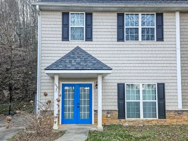 a front view of a house with glass windows