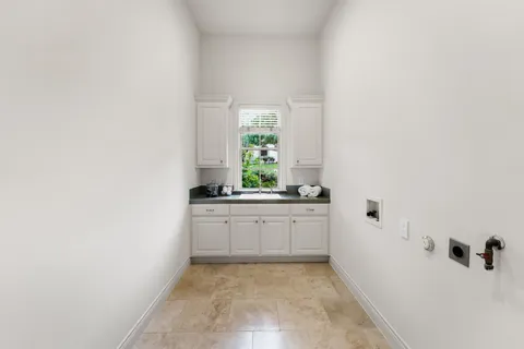 a bathroom with a granite countertop sink and a bathtub