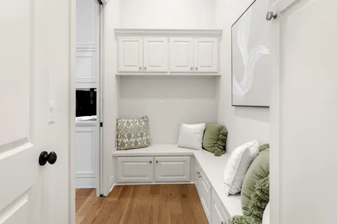 a living room with a couch and a rug