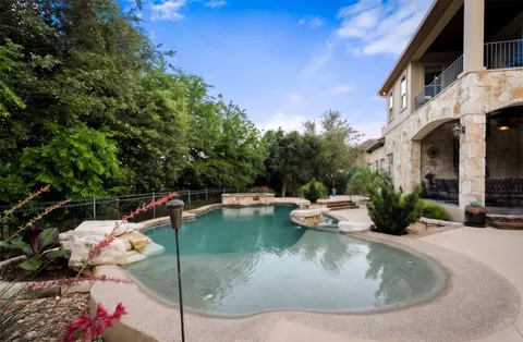 a view of a swimming pool with a patio