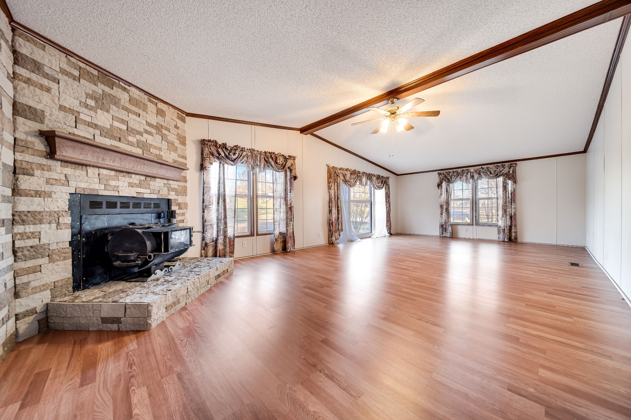 7363 Deer Ridge Road Fairview, TN 37062 - Photo 11 of 24 a view of a livingroom with wooden floor and a fireplace