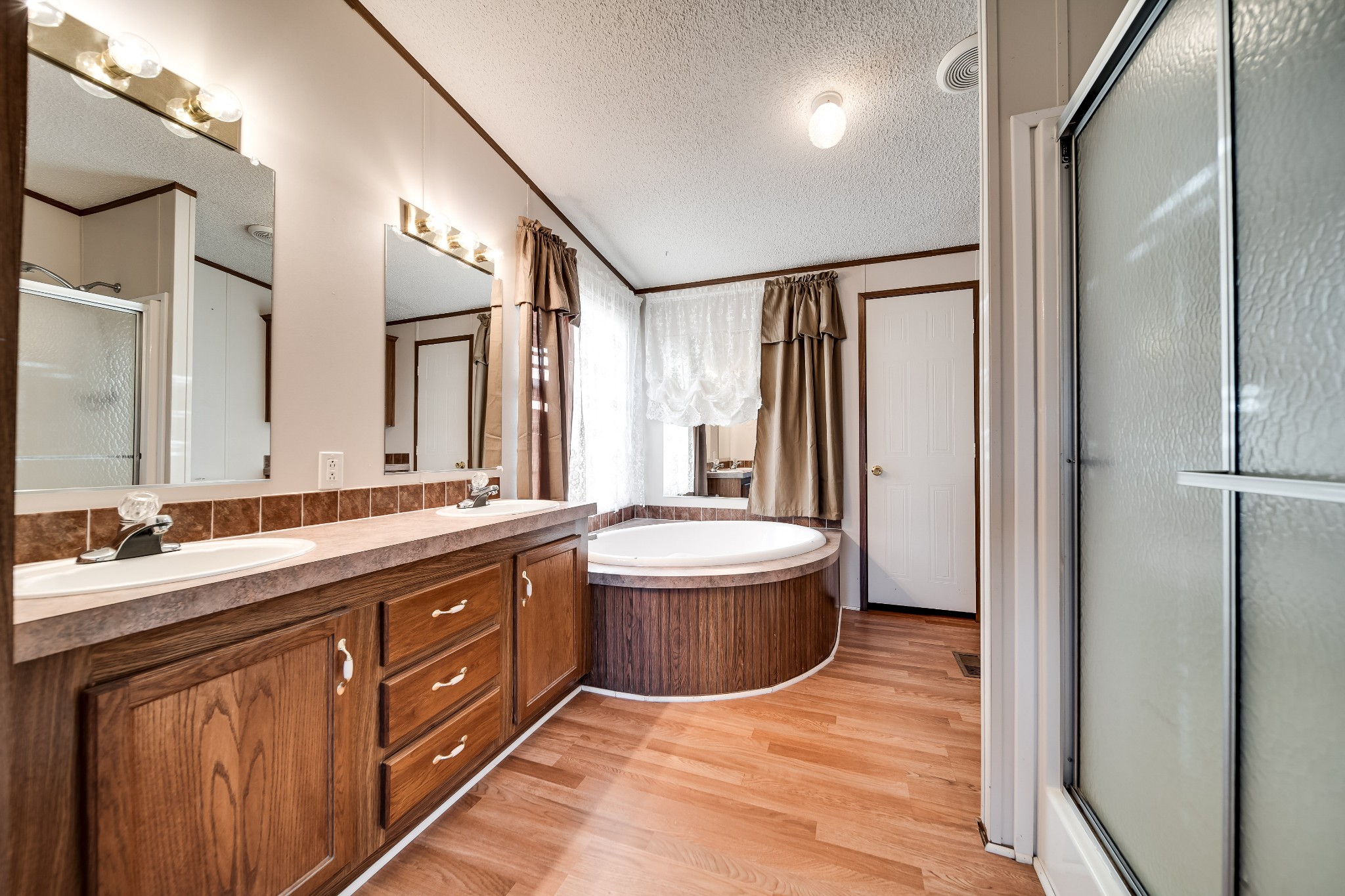 7363 Deer Ridge Road Fairview, TN 37062 - Photo 17 of 24 a bathroom with a double vanity sink and a mirror