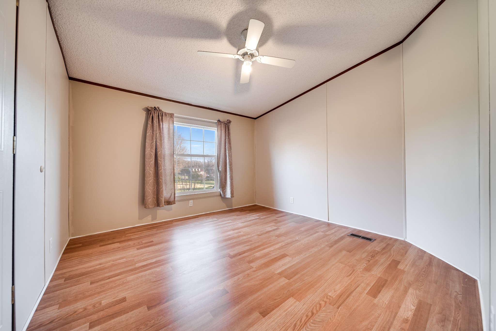 7363 Deer Ridge Road Fairview, TN 37062 - Photo 18 of 24 a view of an empty room with a window and wooden floor