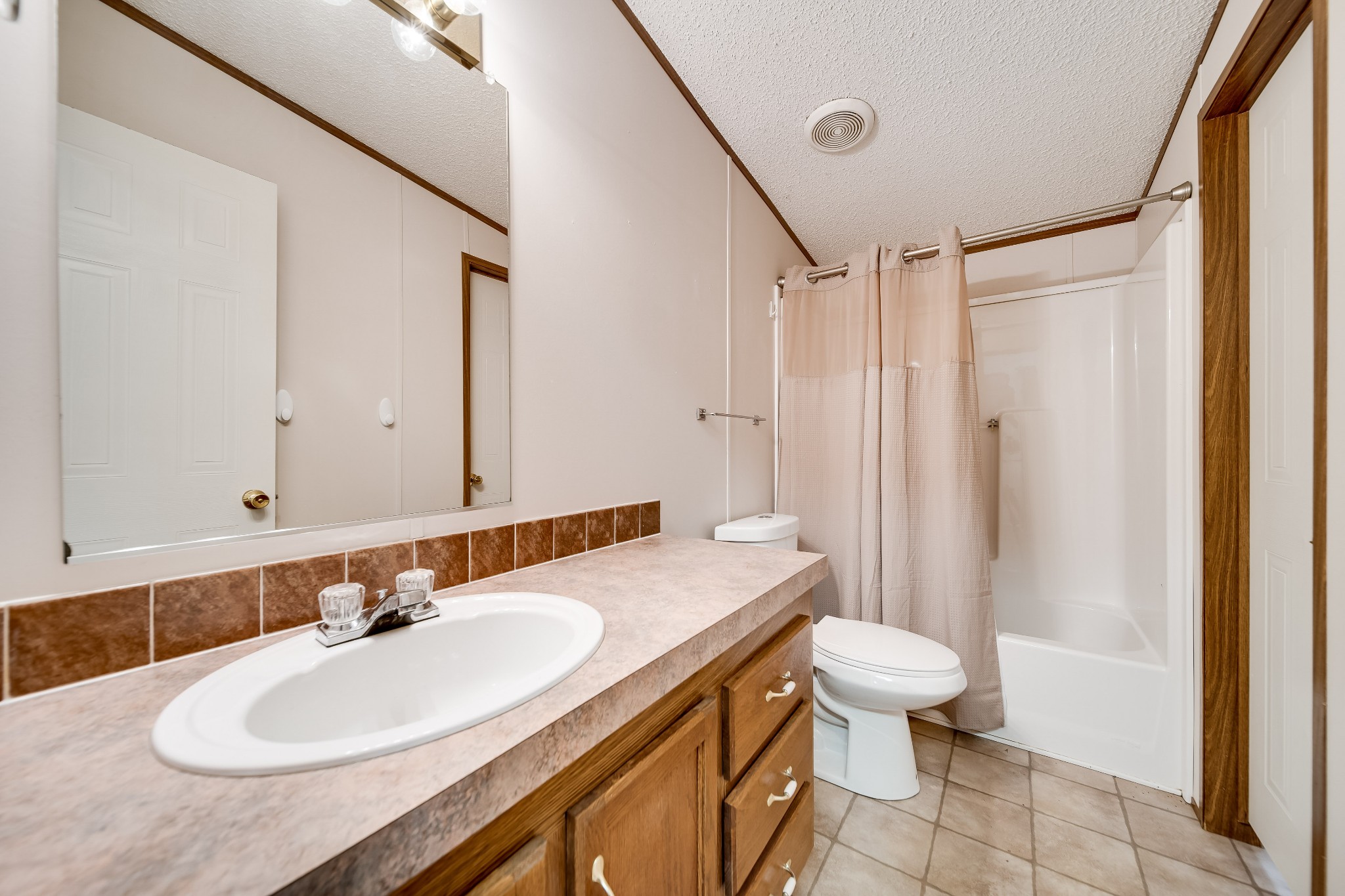 7363 Deer Ridge Road Fairview, TN 37062 - Photo 19 of 24 a bathroom with a sink and a mirror