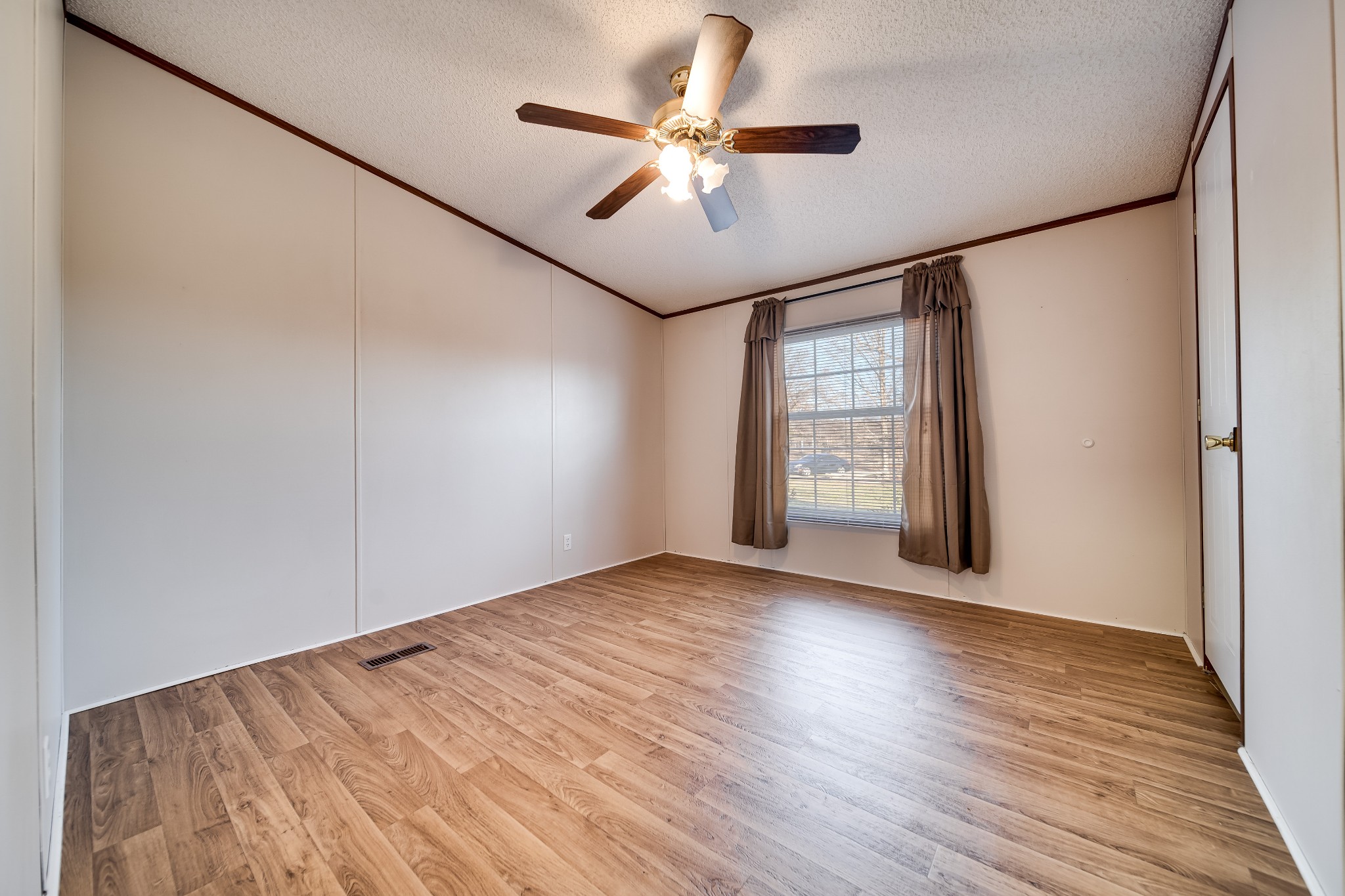 7363 Deer Ridge Road Fairview, TN 37062 - Photo 20 of 24 a view of an empty room with window and wooden floor