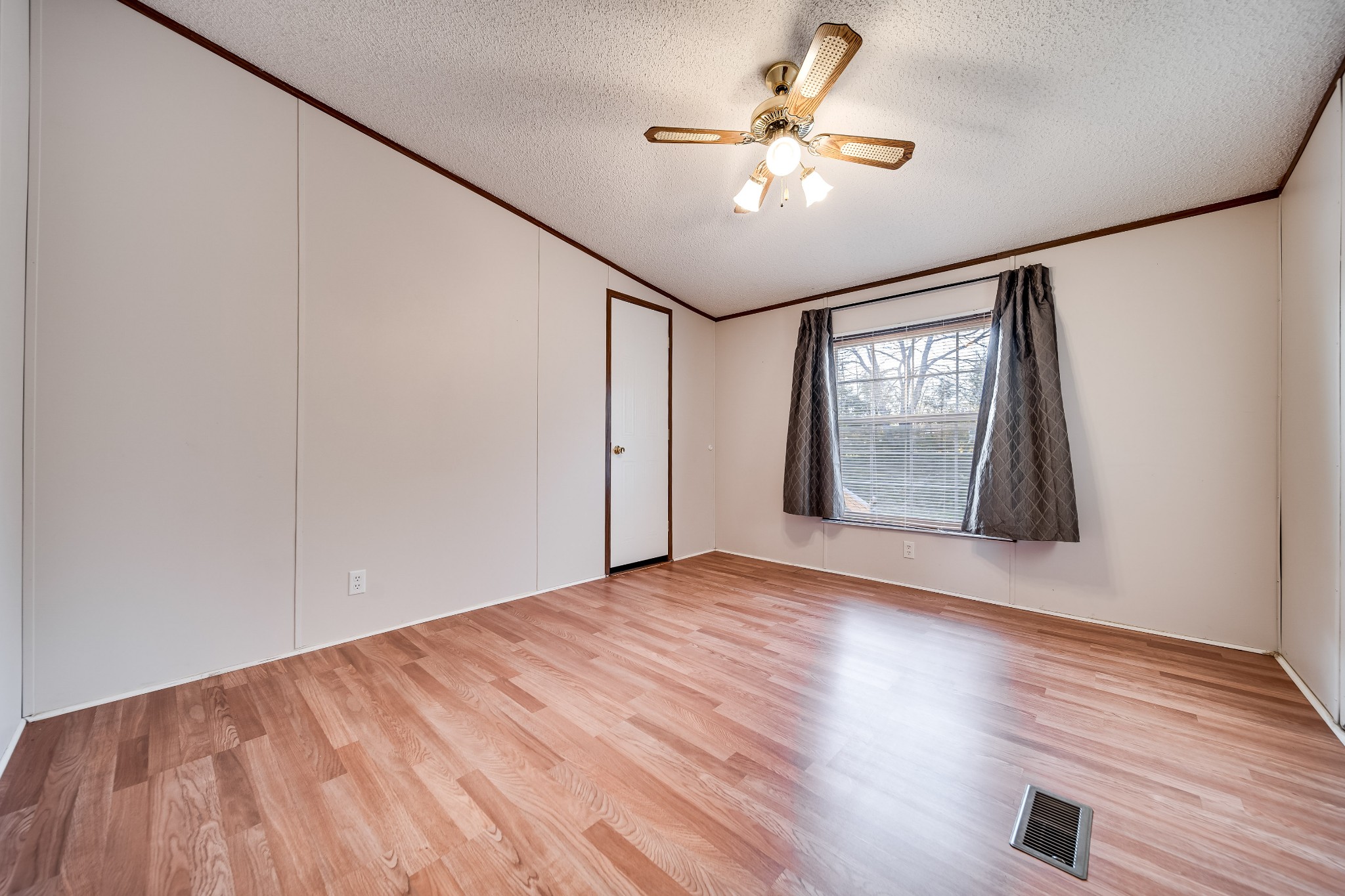 7363 Deer Ridge Road Fairview, TN 37062 - Photo 21 of 24 a view of an empty room with a window and wooden floor