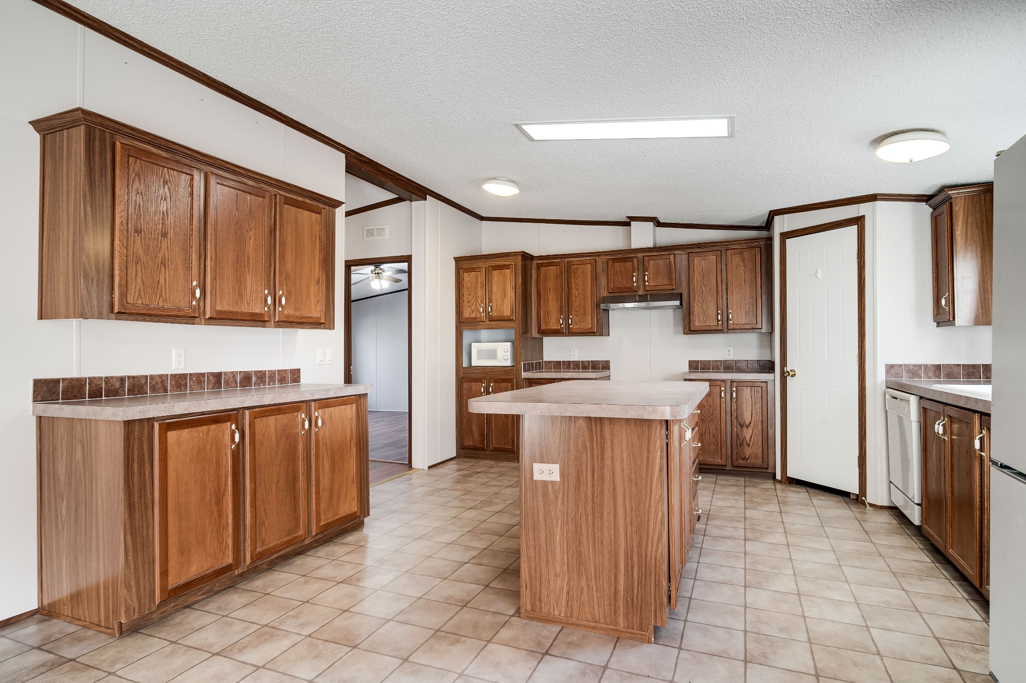 7363 Deer Ridge Road Fairview, TN 37062 - Photo 8 of 24 a kitchen with stainless steel appliances granite countertop a refrigerator a sink and dishwasher