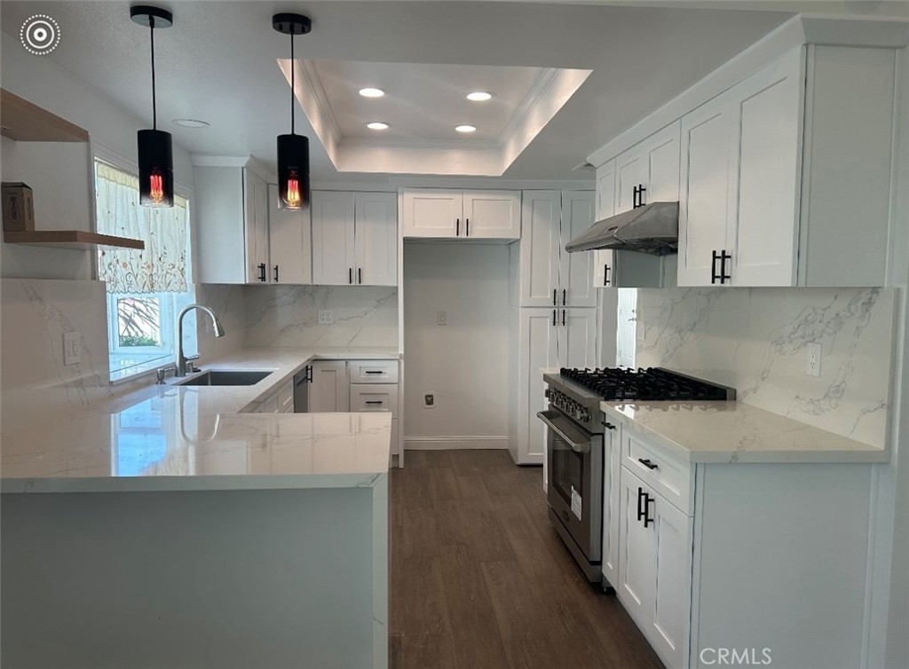 23 Willowbrook Irvine, CA 92604 - Photo 2 of 4 a kitchen with stainless steel appliances granite countertop a sink a stove and a refrigerator
