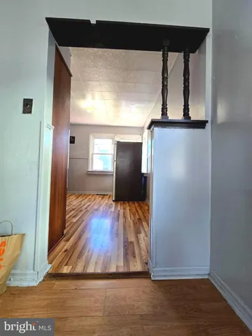 a view of a living room with wooden floor