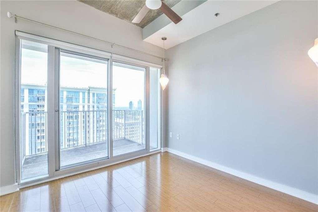 250 Pharr Road Northeast, Unit 2002 Atlanta, GA 30305 - Photo 5 of 13 a view of an empty room with a window