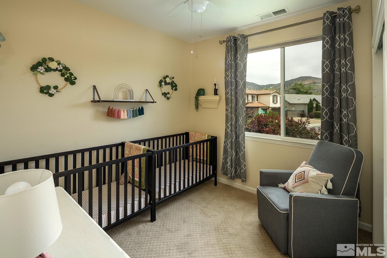 570 Alydar Court Reno, NV 89521 - Photo 23 of 40 a living room with furniture and a window