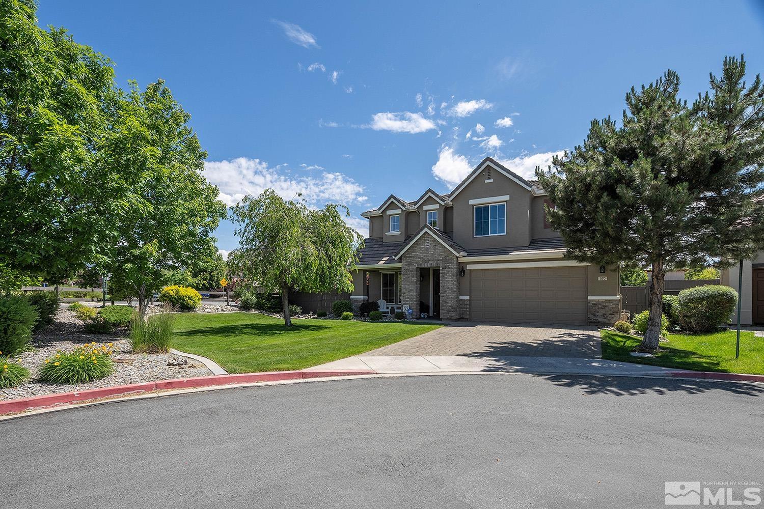 570 Alydar Court Reno, NV 89521 - Photo 39 of 40 a front view of a house with a yard and garage