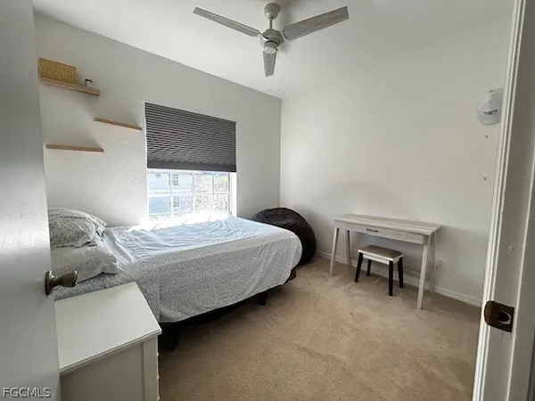 a bedroom with a bed and a chair