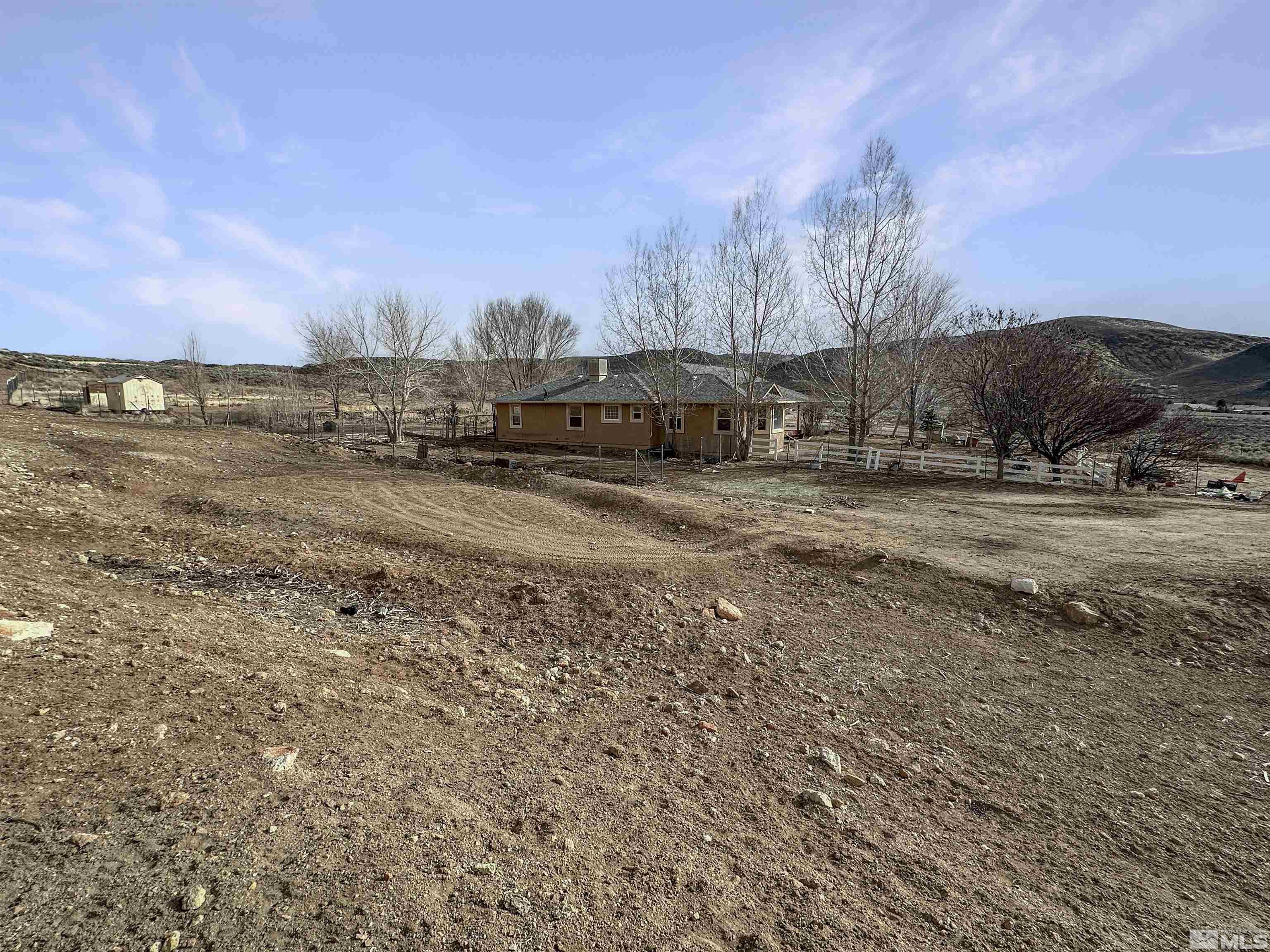 200 Descanso Lane Sparks, NV 89441 - Photo 27 of 28 a view of dirt yard with a large tree