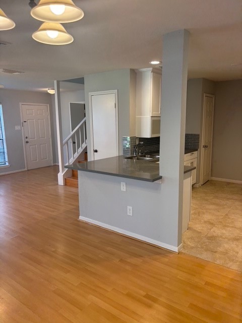 2211 South Kirkwood Road, Unit 22 Houston, TX 77077 - Photo 3 of 15 a kitchen with stainless steel appliances granite countertop a sink a stove top oven a counter space and cabinets