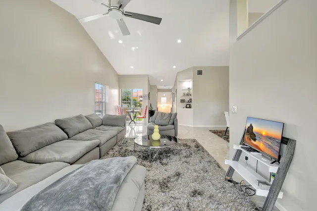a view of a very nice looking dining room with furniture window and outside view