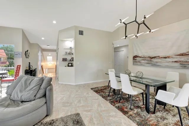a kitchen with stainless steel appliances a stove a sink and a refrigerator