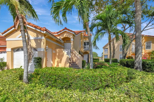 a view of a palm trees in front of a house