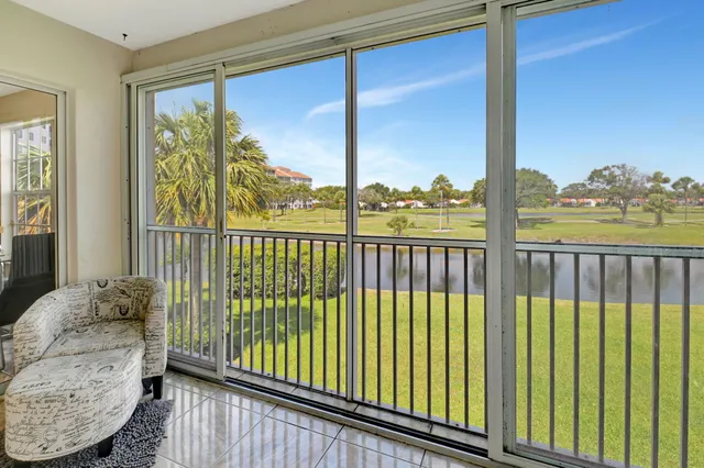 a view of a balcony with furniture