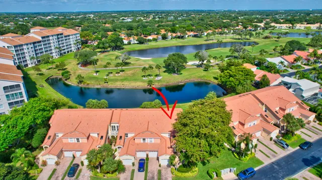 an aerial view of residential houses with outdoor space and river