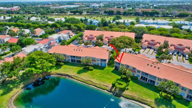 a view of a house with garden and a yard