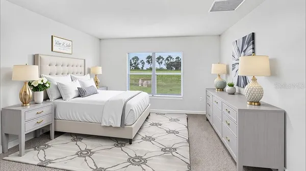 a spacious bedroom with a large bed and a window