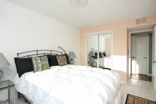 a bathroom with a toilet a sink and a mirror