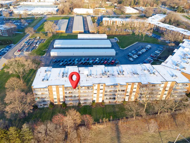 a view of swimming pool with a yard and plants