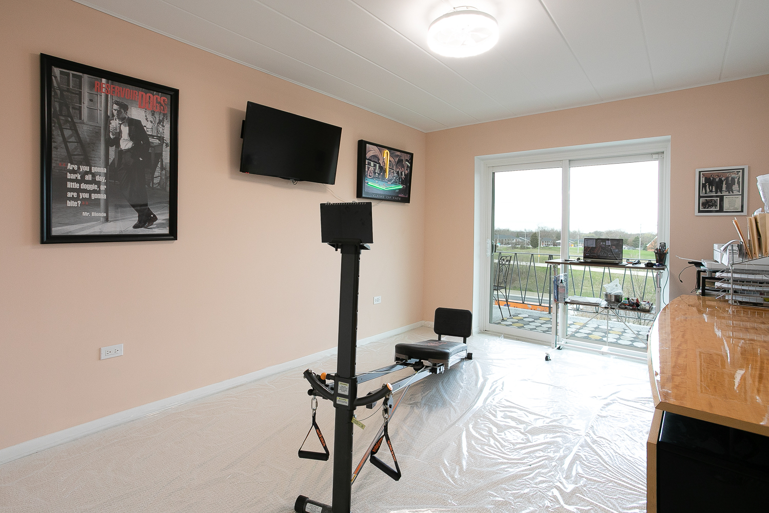 2900 Maple Avenue, Unit 19E Downers Grove, IL 60515 - Photo 22 of 32 a view of a living room with a flat screen tv and a large window