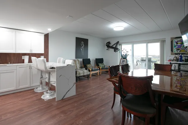 a view of a dining room with furniture window and wooden floor