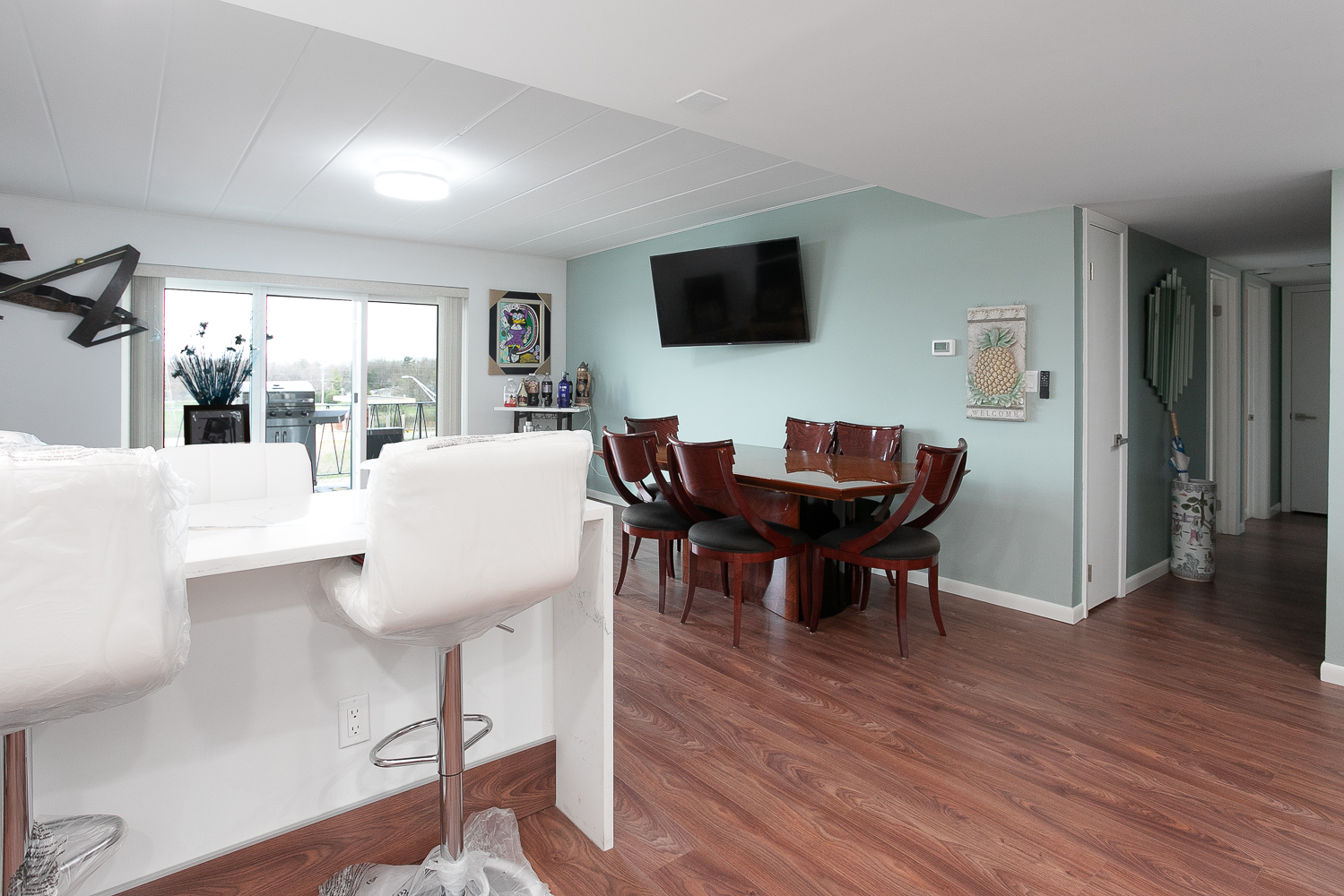 2900 Maple Avenue, Unit 19E Downers Grove, IL 60515 - Photo 27 of 32 a view of a dining room with furniture window and wooden floor