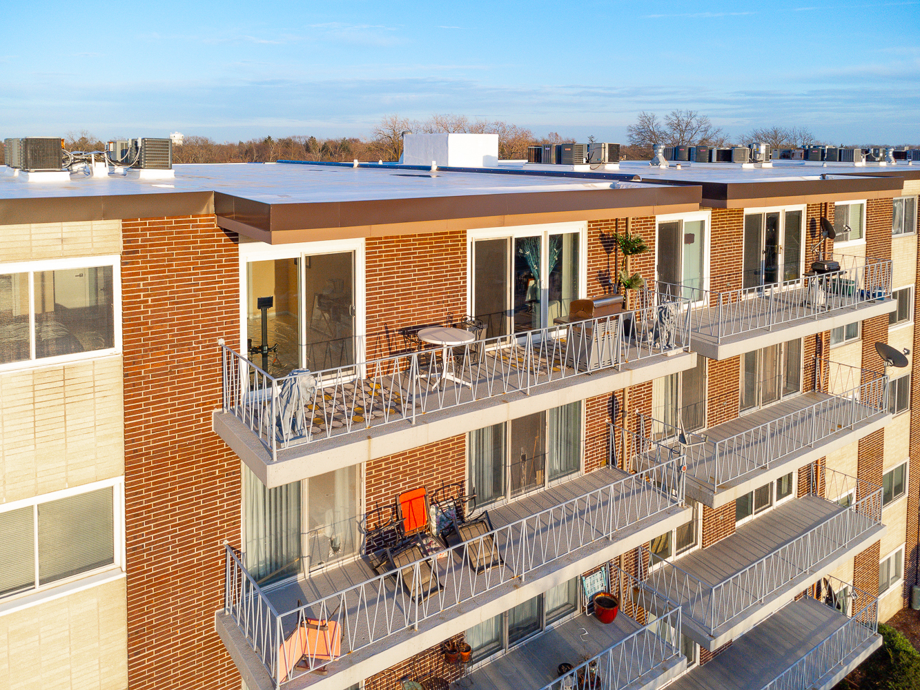 2900 Maple Avenue, Unit 19E Downers Grove, IL 60515 - Photo 4 of 32 front view of a building with a lot of windows