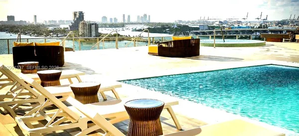 a view of a swimming pool with a lounge chairs