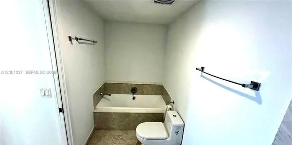 a bathroom with a sink and toilet