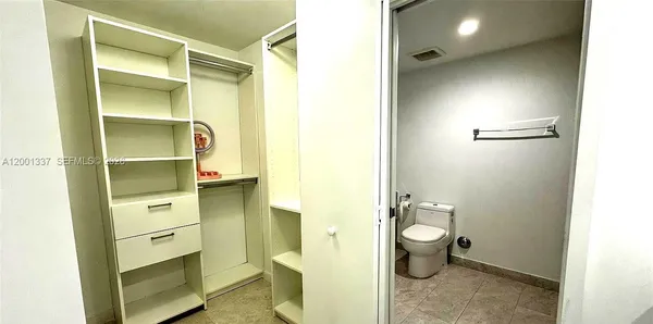 a bathroom with a toilet sink and a shower