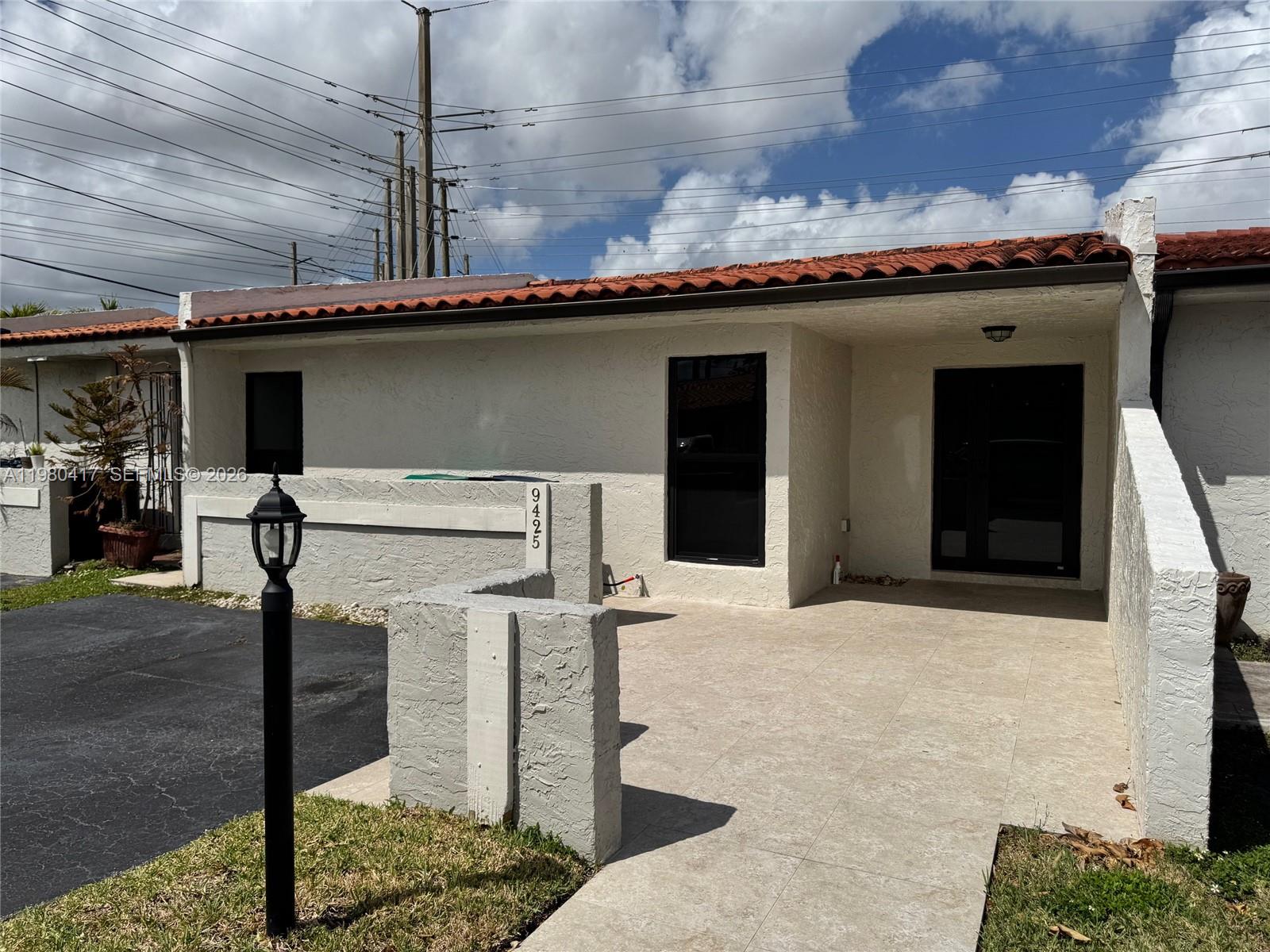 9425 Southwest 4th Lane, Unit 9425 Miami, FL 33174 - Photo 2 of 14 a kitchen with a sink and a stove