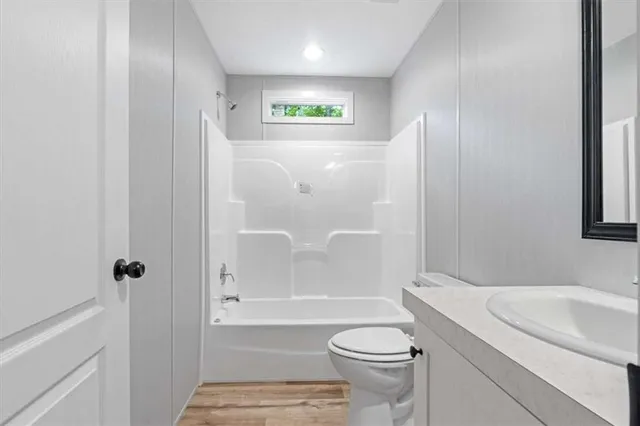 a bathroom with a sink a toilet and a bathtub