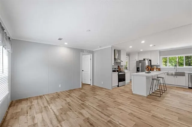 a view of kitchen and wooden floor