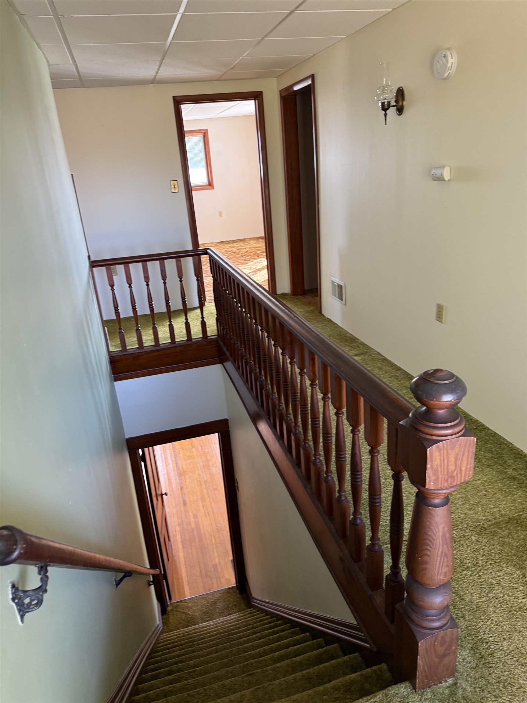 5940 East German Valley Road German Valley, IL 61039 - Photo 20 of 29 a view of staircase with lots of frames on wall and a window