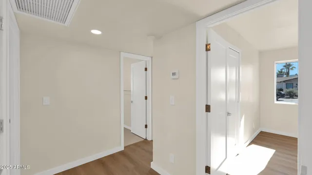 a view of a bathroom with wooden floor
