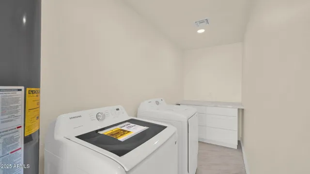 a utility room with dryer and washer