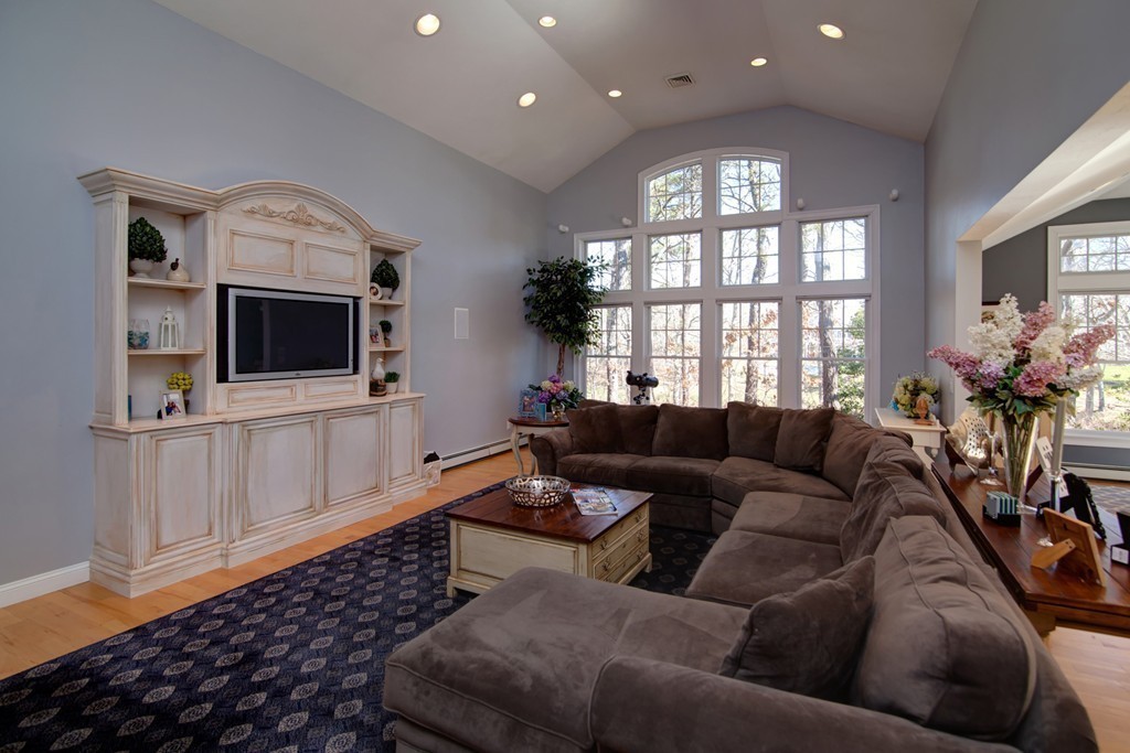 84 Troon Place Mashpee, MA 02649 - Photo 15 of 30 a living room with furniture and a flat screen tv