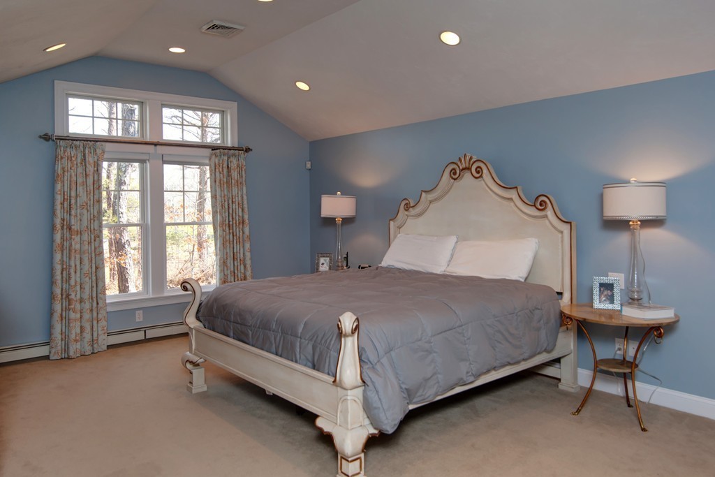 84 Troon Place Mashpee, MA 02649 - Photo 20 of 30 a spacious bedroom with a bed and a window